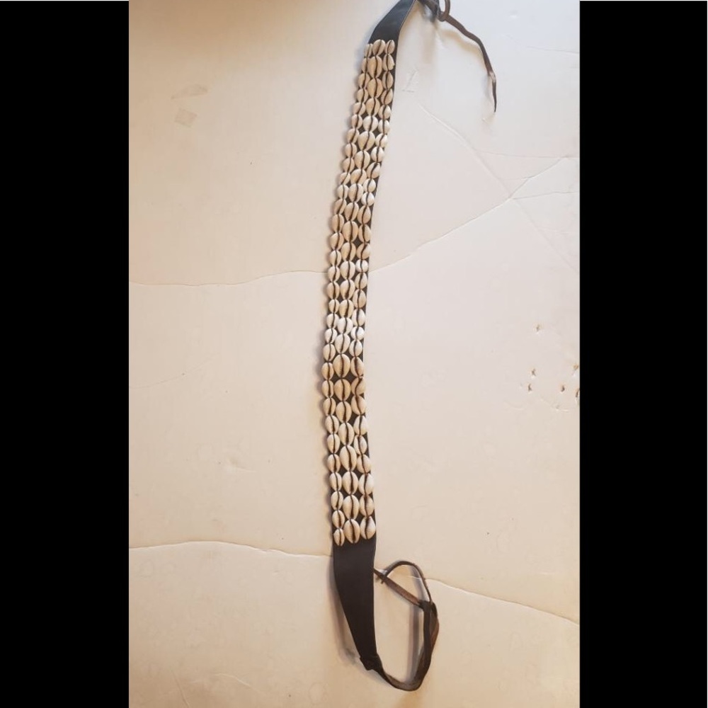 Three strand cowrie shell belt on black leather
